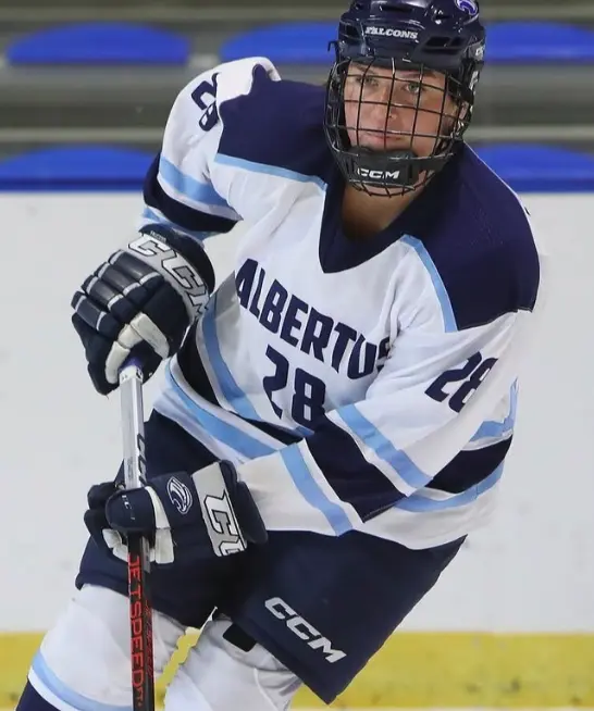 Albertus women's hockey game uniform in action