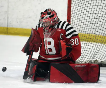Branford Hornets goalie wearing the red game uniform