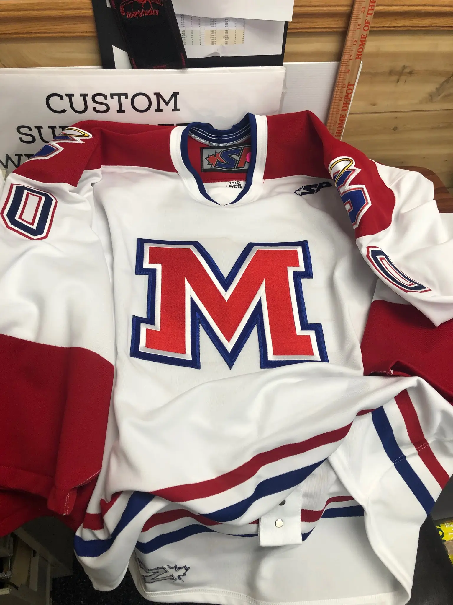 Finished Mount St. Charles Academy white hockey jersey