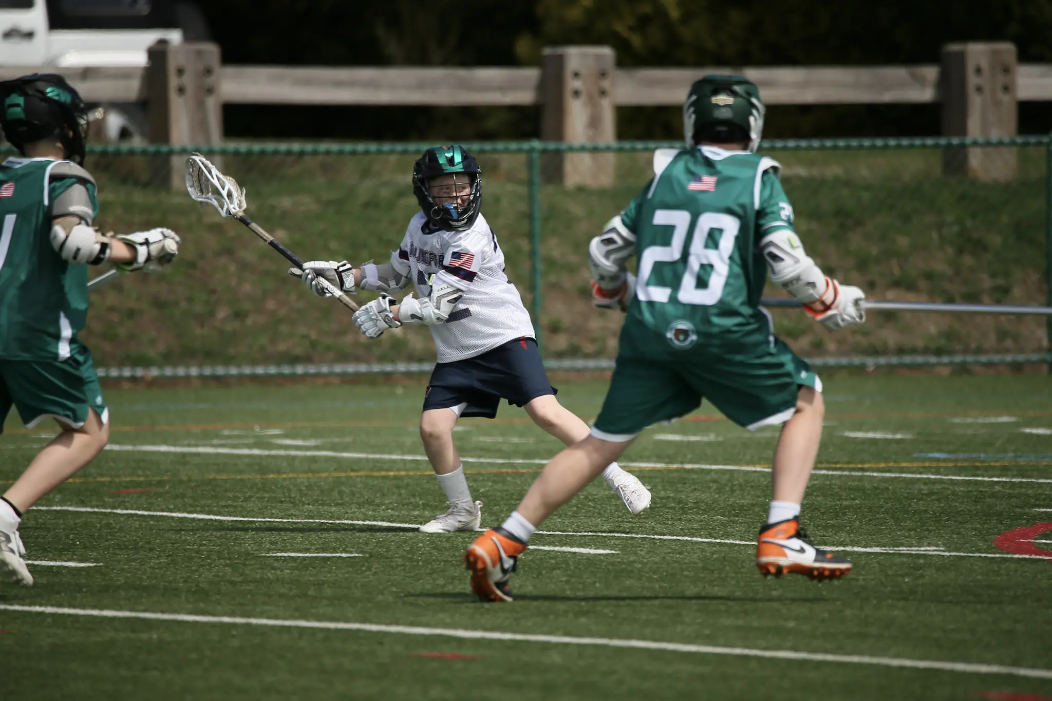 Wallingford lacrosse player in white game uniform