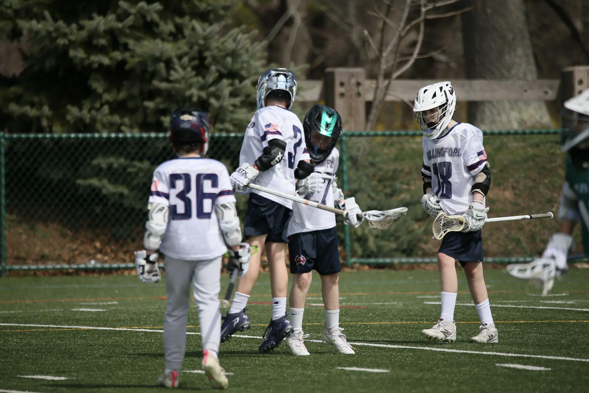 Wallingford lacrosse team wearing white game uniforms
